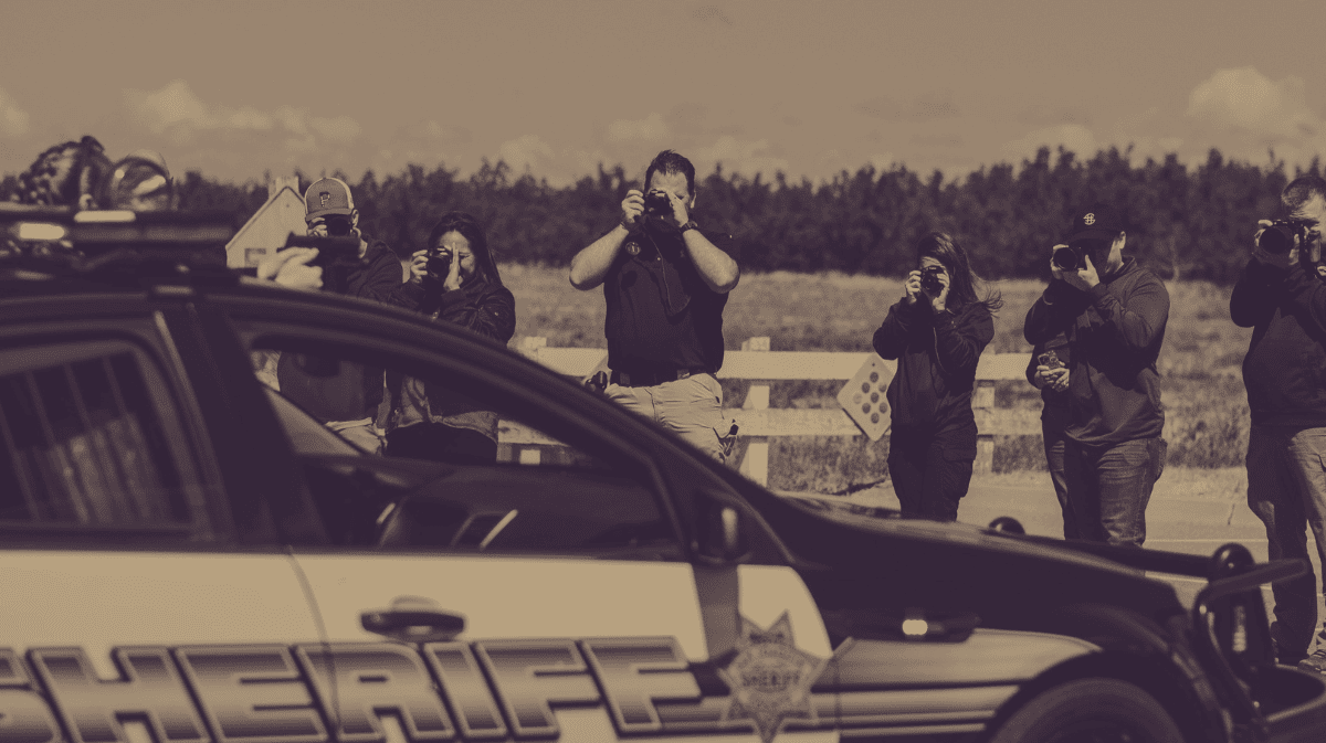 Police officers learning professional photography skills from TOC Public Relations